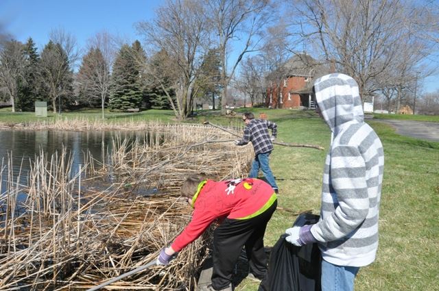 Cleaning up around the lake.